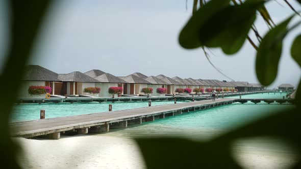 Luxury Overwater Villas on Turquoise Lagoon White Sandy Beach in Maldives