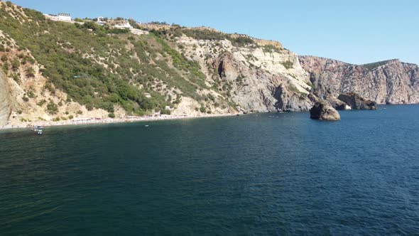 Aerial View From Above on Calm Azure Sea and Volcanic Rocky Shores