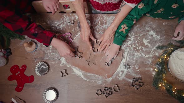Cute Children Making Cookies with Mother on Christmas Day at Home