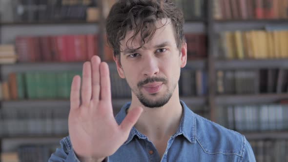 Stop Gesture By Casual Young Man Denying and Rejecting