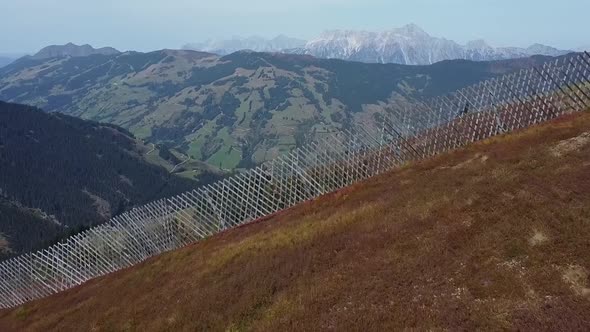 Flying over the alpine meadow where autumn has already arrived