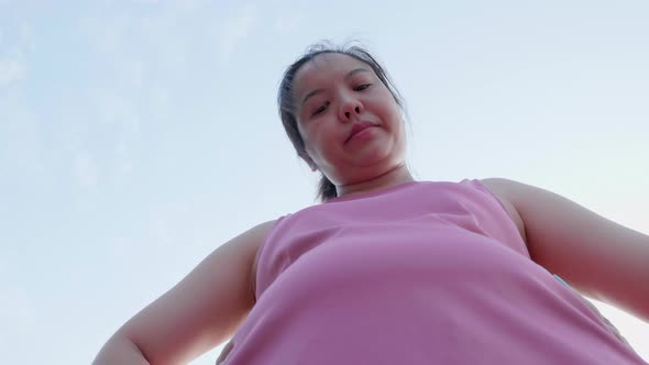 Unhappy boring overwieght of young sport Asian fat woman serious with belly stomach