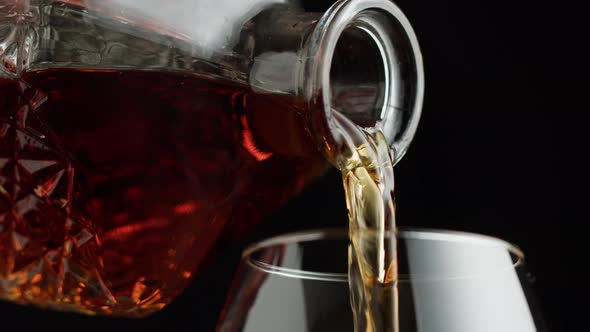 Pouring Brandy or Whiskey Closeup