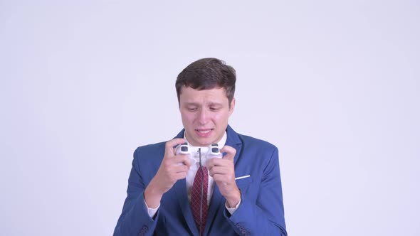 Young Handsome Businessman Playing Games