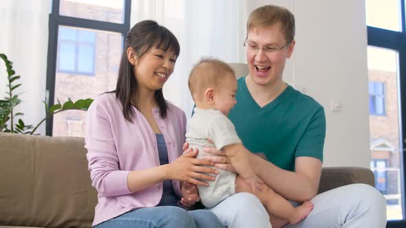 Happy Family with Baby Boy at Home