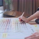 close up hand,young asian female creative partnets working with color swatch discussion  brainstorm - VideoHive Item for Sale