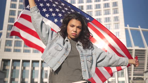 Angry Mixed Race Woman Shouting Holding USA Flag Protesting Alone on Street
