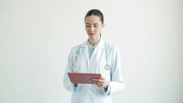 Portrait of Female Doctor Using Tablet