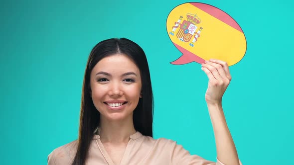 Beautiful Woman Holding Spanish Speech Bubble, Foreign Language Courses, Travel