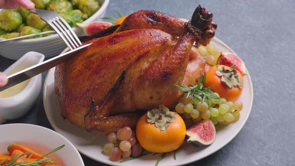 Roasted Whole Chicken Served with Fruits on Plate on Dark Background