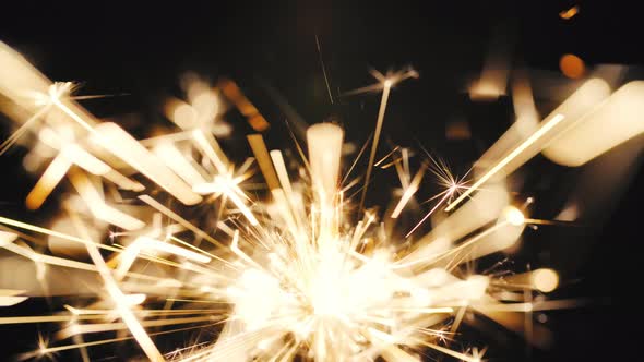 Burning Christmas Sparkler Isolated on Black Background 