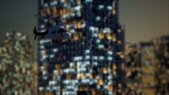 Slow Motion Helicopter Near Skyscrapers at Night