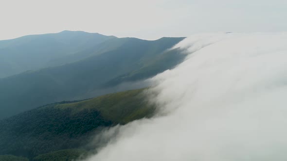 Flight Into the Fog Over the Mountain Massif Polonyna Borzhava