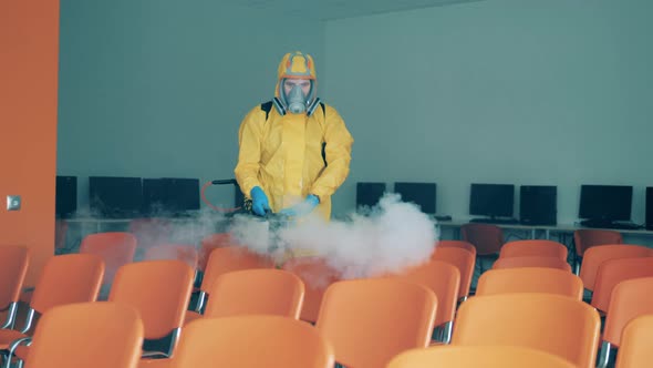 A Disinfection Worker Sanitizer Chairs with a Sprayer.