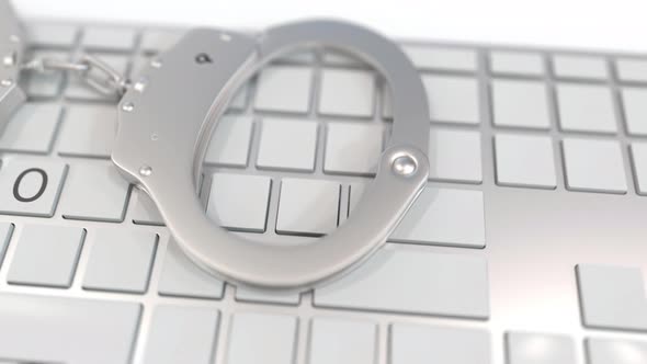 Handcuffs on Keyboard with CASINO Text on Keys