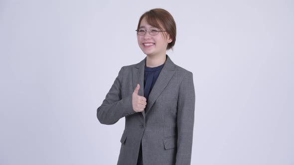 Young Happy Asian Businesswoman Giving Thumbs Up