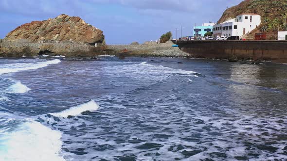 Waves crashing a harbor and a stone pier,Tenerife,Canary Islands,Spain.