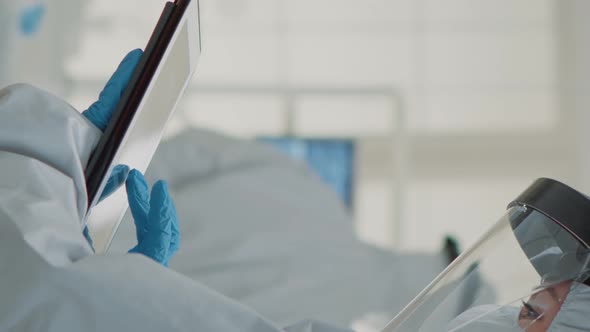 Vertical Video Dental Assistant Examining Teeth x Ray on Digital Device