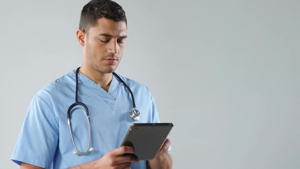 Male doctor using digital tablet 4K 4k