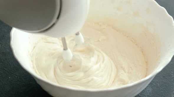  Woman's Hands Knead the Dough for Pie with a Mixer. Cooking Apple Pie.