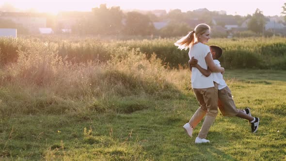 Mother and Son Having Fun Together in a Field