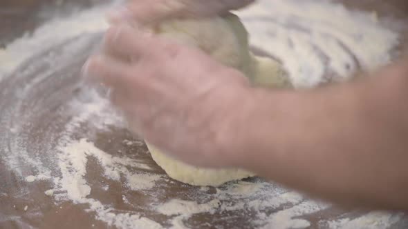 Baker Hands Kneading Dough