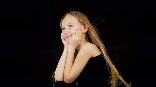 Fashion Model Young White Caucasian Girl with Long Blonde Hair Waving on Wind Surprised at Dark