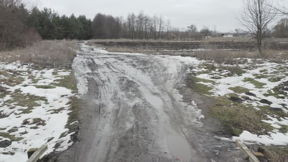 Crossing the River Over a Wooden Road Bridge in the Spring  Dolly Out Shot