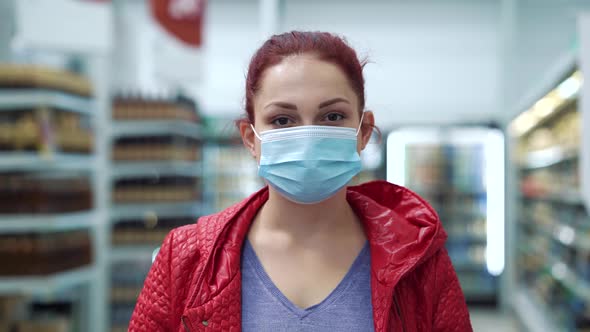 Woman in medical mask posing in mall