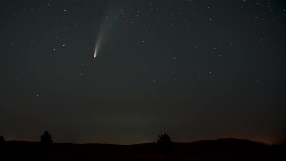 The Comet Moves Across the Night Sky Among the Stars