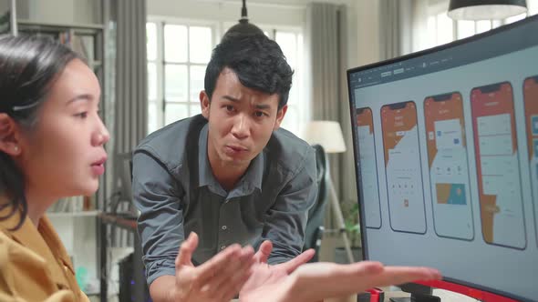 Asian Male And Female Mobile Application Designers Arguing And Discuss New App Features