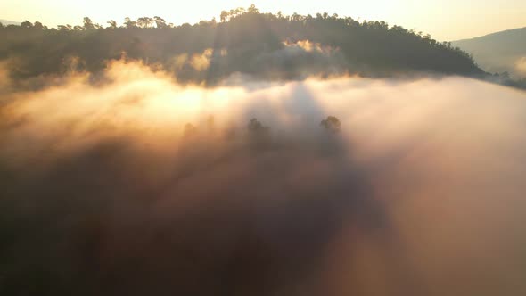 4K Drone Flying through the clouds at dusk or dawn. Aerial top cloudscape