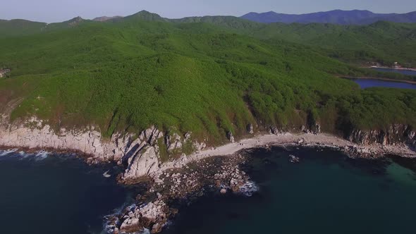 Aerial View of a Beautiful Promontory with Clear Blue Water