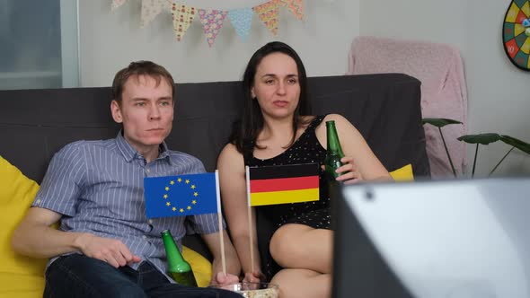 European Couple Watching Olympic Games on TV