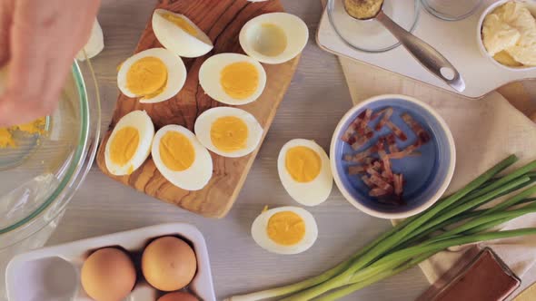 Time lapse. Preparing deviled eggs with organic eggs for appetizer. Step by step recipe.