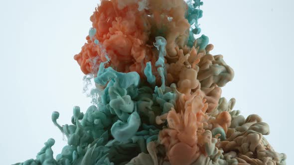 Slow motion shot of blue and orange ink into water, shot with Phantom Flex 4K camera. alt