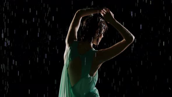 Beautiful Woman Dancing In The Rain