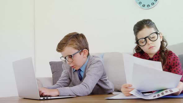 Kids as business executive working at desk 4k