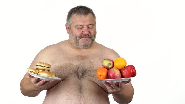 Fat Guy Choosing Between Sandwich and Fruits