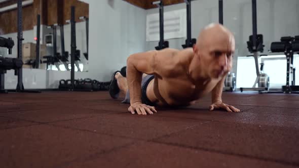 Man doing burpee in the gym