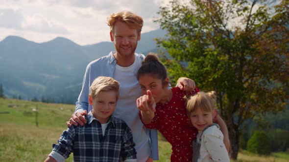 Smiling Family Posing Mountains Close Up