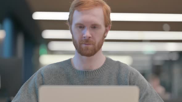 Portrait of Man Working on Laptop