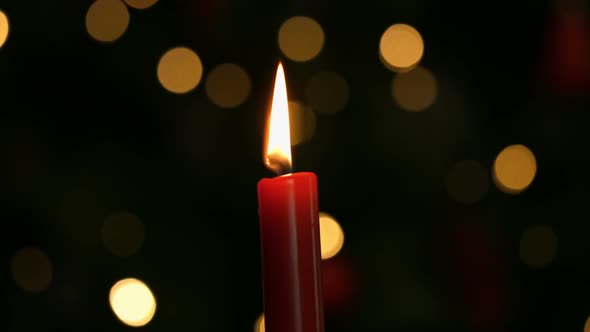 Candle burning at christmas time