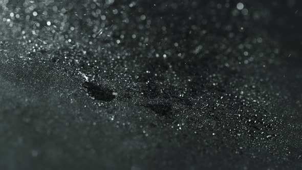 Super Slow Motion Shot of Water Splashing on Waterproof Cloth at 1000Fps