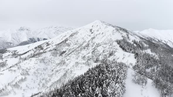 Aerial View of Cold Mountain Top Snow Ice Tourism Sport Eco Travel Mountains Peaks Cliffs Rocks