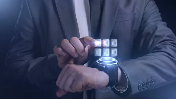 A Man in a Suit Works with the Smart Watch of the Future