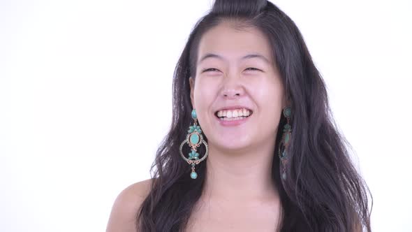 Face of Happy Beautiful Asian Woman Thinking Ready To Party