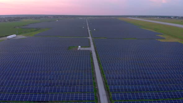 Drone Fly Over Solar Farm. Renewable Green Energy and Electrical Technology. Field of Solar Panels