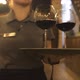 Waitress Carries Red Wine To Guests Sitting in Restaurant - VideoHive Item for Sale