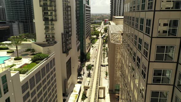 Aerial Drone Rising Between Buildings In Miami City